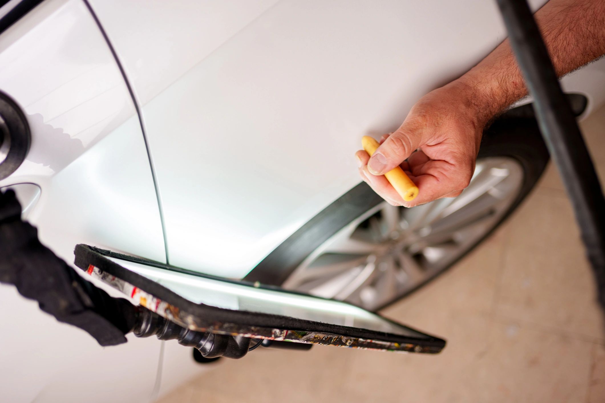 Dent removal at auto body shop