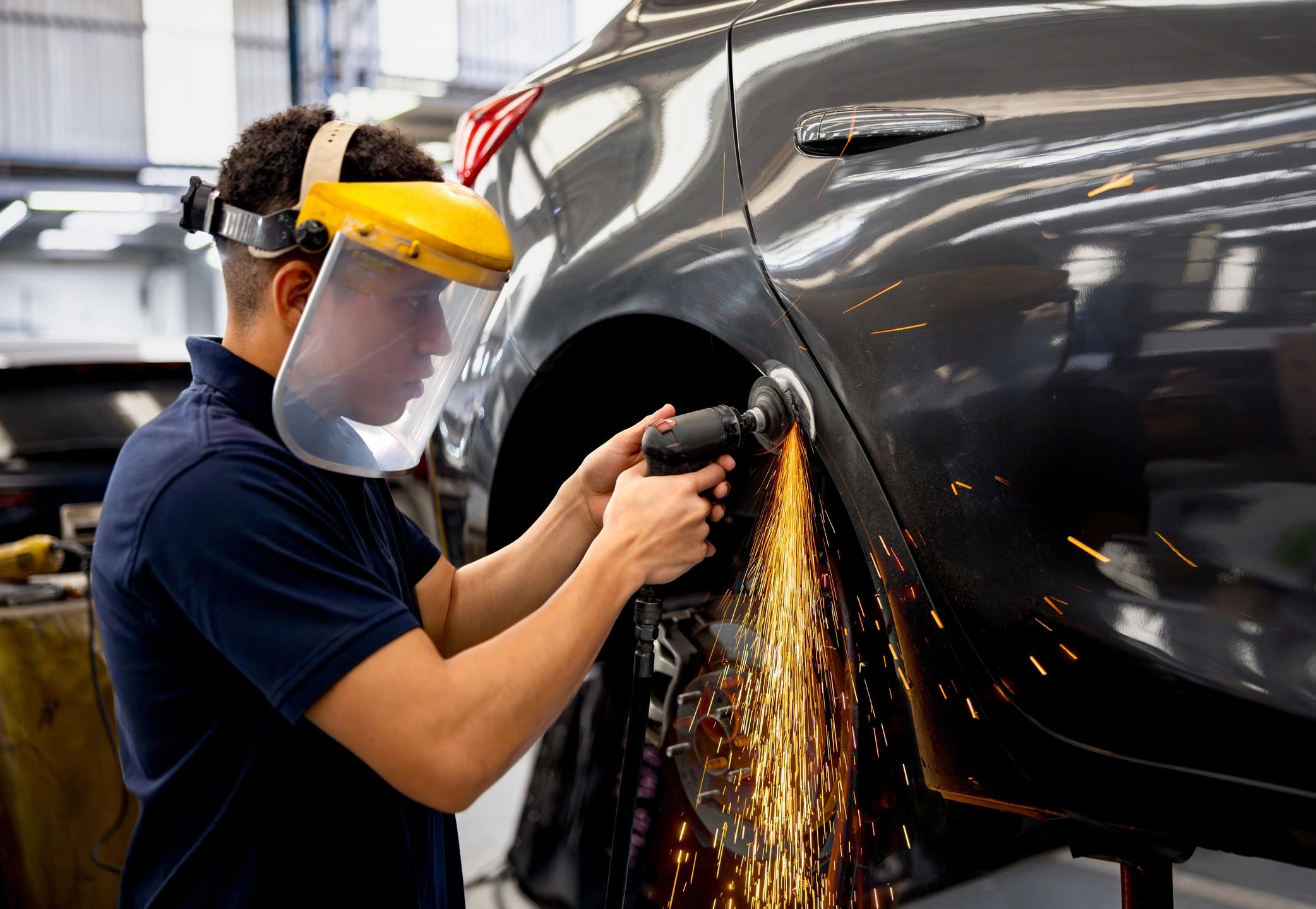 Collision repair shop working on vehicle